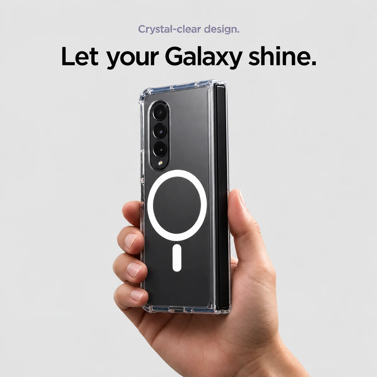 Clear magnetic phone case held at an angle, showing its transparent back and camera openings. #Samsung Model_Samsung Z Fold 3