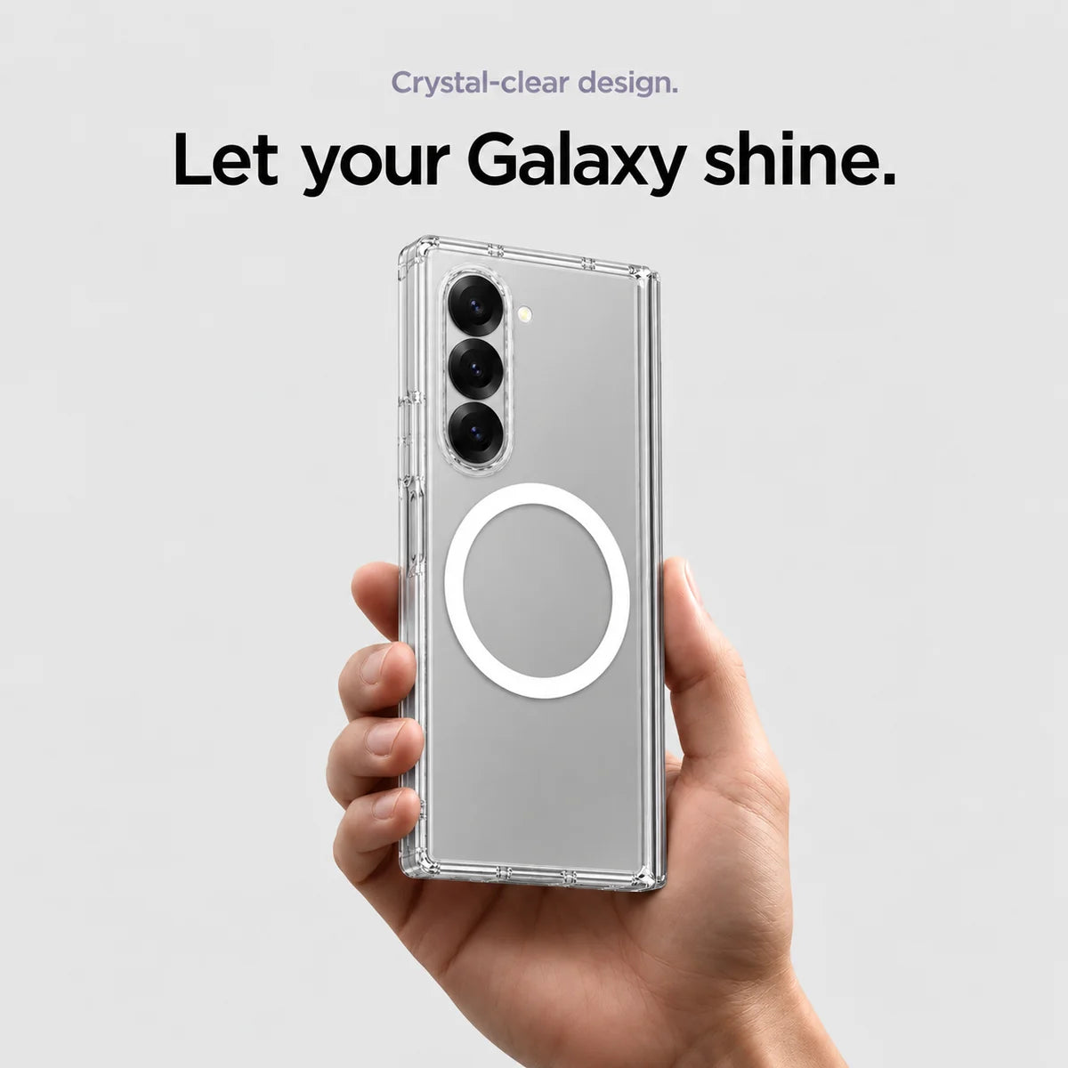 Clear magnetic phone case held at an angle, showing its transparent back and camera openings. #Samsung Model_Samsung Z Fold 6