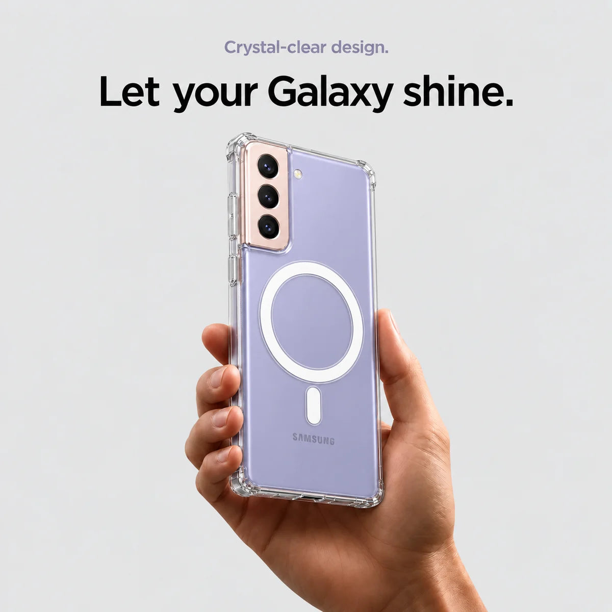 Clear magnetic phone case held at an angle, showing its transparent back and camera openings. #Samsung Model_Samsung S21+