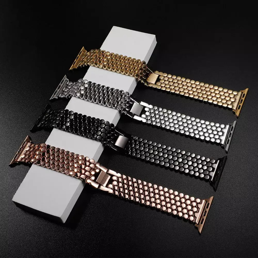 Elegant stainless steel Apple Watch band for women with a polished slim-link design, perfect for formal and casual wear.